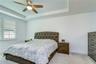 Spacious first-floor owner's retreat with tray ceiling.