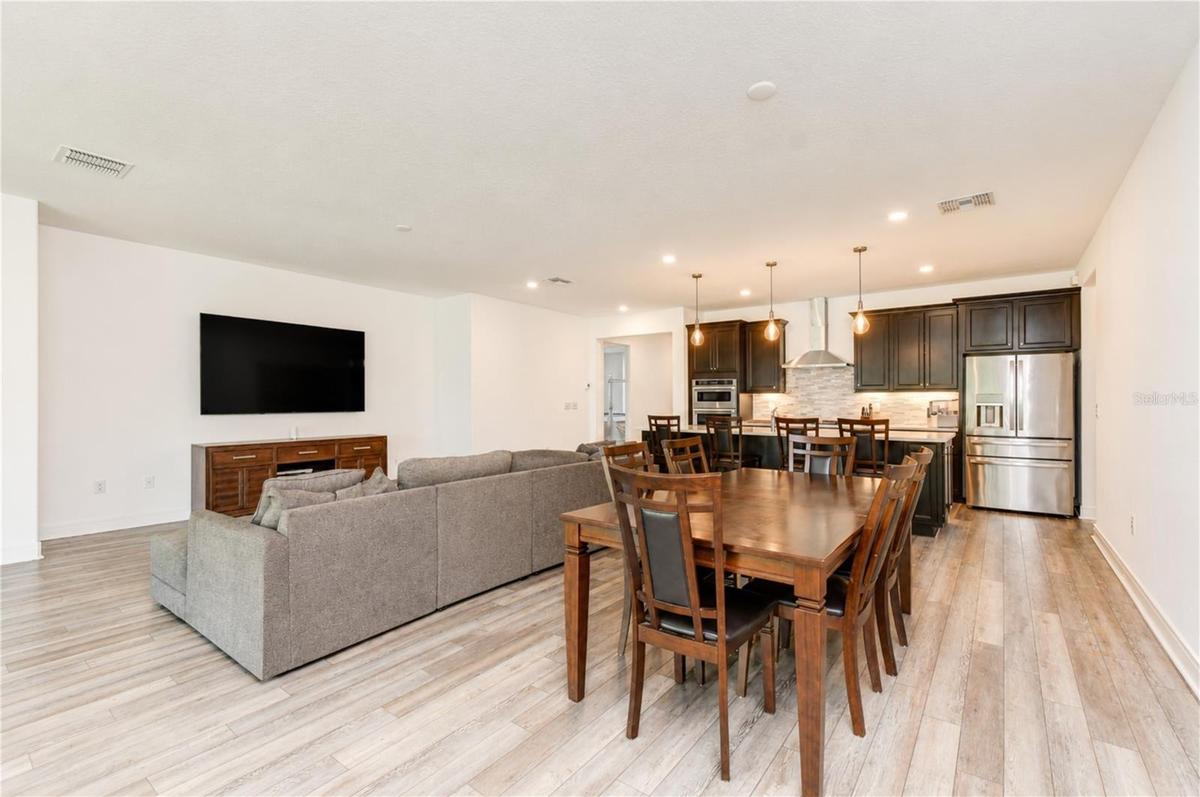 Durable luxury vinyl flooring flowing throughout the main living areas.