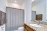 Full bath conveniently serving the rear secondary bedrooms.