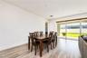 Seamlessly connected dining space overlooking the great room.