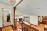 Staircase with wood railing and balusters