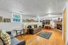 Finished Basement Family Room featuring warm wood-finish flooring, recessed ceiling lighting, and abundant wall space for display