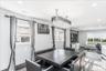 Open-concept living space with dark wood-finish flooring