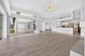 Family Room, Eating Area, Kitchen, Living Room and Large Covered Lanai with Screened Grassy Area for Pets or Pool