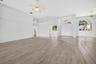 Large Living Room with view of Dining Room, Entryway, Den/4th Bedroom and Half Bath for Guests and 4th Bedroom