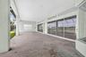 Large Covered Lanai with Doors to Primary Bedroom and Living Room - Edge of Aquarium Window