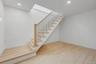 Full basement with high ceilings and outside entrance, offering excellent potential for future finished space or storage.