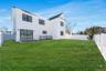 Level backyard space accessible from the main living area, providing room for outdoor enjoyment and entertaining.