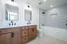 Full hall bath serving the secondary bedrooms, designed with modern finishes and functionality in mind.