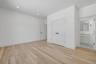 Private first floor junior primary bedroom with a full bath, ideal for guests, or a flexible office setup.
