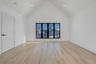 Spacious retreat with vaulted ceilings and large windows, dual walk in closets and primary bath.