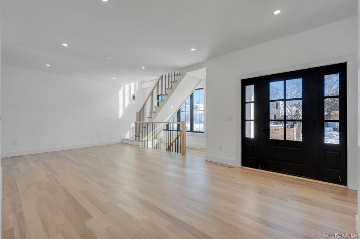Bright and welcoming entry with clean architectural lines and natural light that immediately sets the tone of the home.