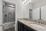Upstairs bathroom with dual sinks