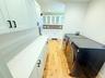 Kitchen opens to the laundry room.
