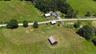 House on right of pic; showing all 3 barns as well and the land layout