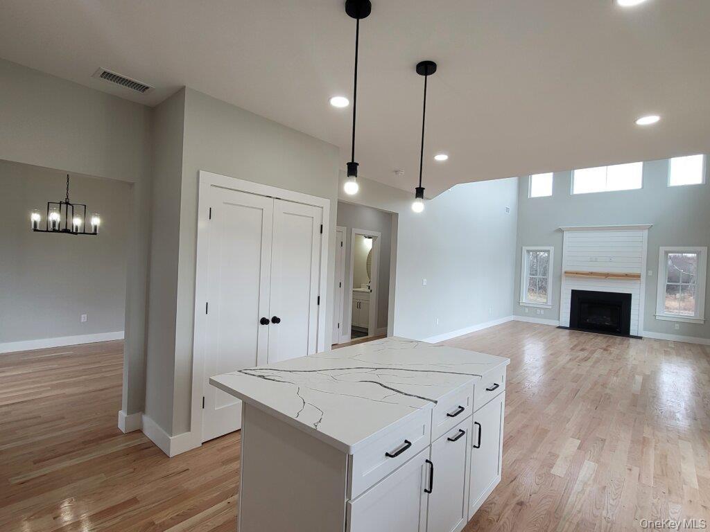 Illustrating the home's open flow, creating an ideal environment for easy entertaining in the formal dining room or casual gathering in the great room