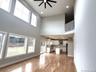 An alternate view of this gathering space highlighting the open-concept design and seamless connection between main living areas.