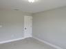 Additional views of bedrooms with the flexibility to be a playroom, media room, or dedicated fitness space.