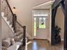 Filled with natural light and enhanced by elegant finishes, the entry foyer sets the tone for the warmth and character found throughout the home.