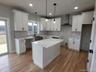 Abundant cabinetry, designer finishes and thoughtful attention to everyday functionality are present throughout this well appointed kitchen.