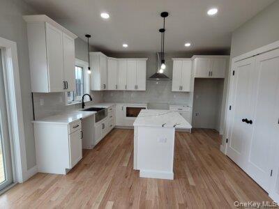 Beautifully appointed kitchen showcasing quality cabinetry, quartz countertops, stainless steel appliances, and generous workspace.