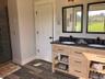 A dual-sink vanity provides added convenience whole offering ample storage for daily essentials.