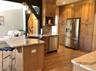 A well appointed kitchen offers abundant cabinetry, generous work space, and everyday functionality.