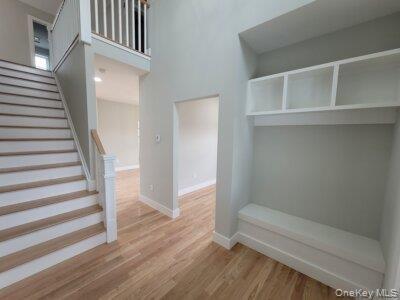 Thoughtfully designed entrance foyer featuring seating and built-in storage to compliment everyday living and entertaining with elegant functionality.