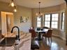 Natural light fills the dining area creating an inviting space for everyday meals and special occasions.