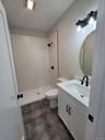 Another view of the bathroom's attractive finishes and efficient layout.