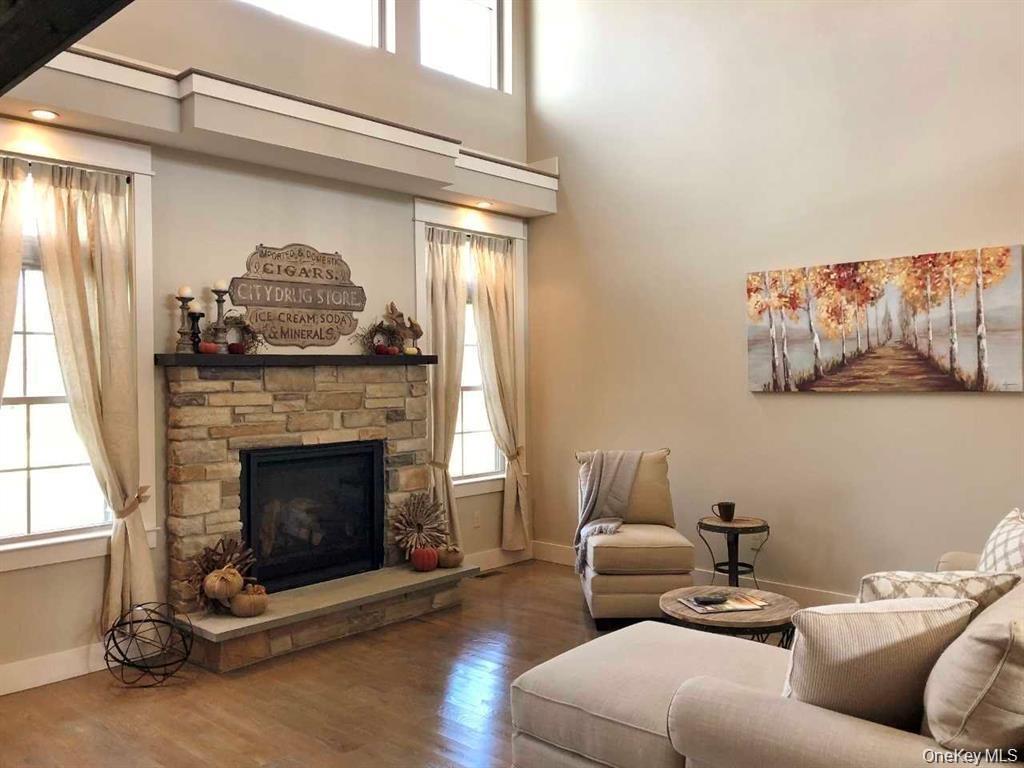 Designed for gathering and everyday living, this expansive open living space features dramatic vaulted ceilings, and a cozy fireplace. The flowing lay