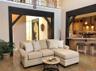 The inviting living room offers a warm gathering space centered around a beautiful fireplace.