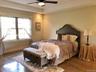 Natural light and a well proportioned design create a bright, welcoming bedroom with everyday comfort in mind.