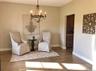 Create a quiet retreat in this inviting sitting area, perfectly suited for reading, conversation, or a peaceful morning coffee.
