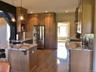 An open kitchen layout creates seamless connection to surrounding living spaces.