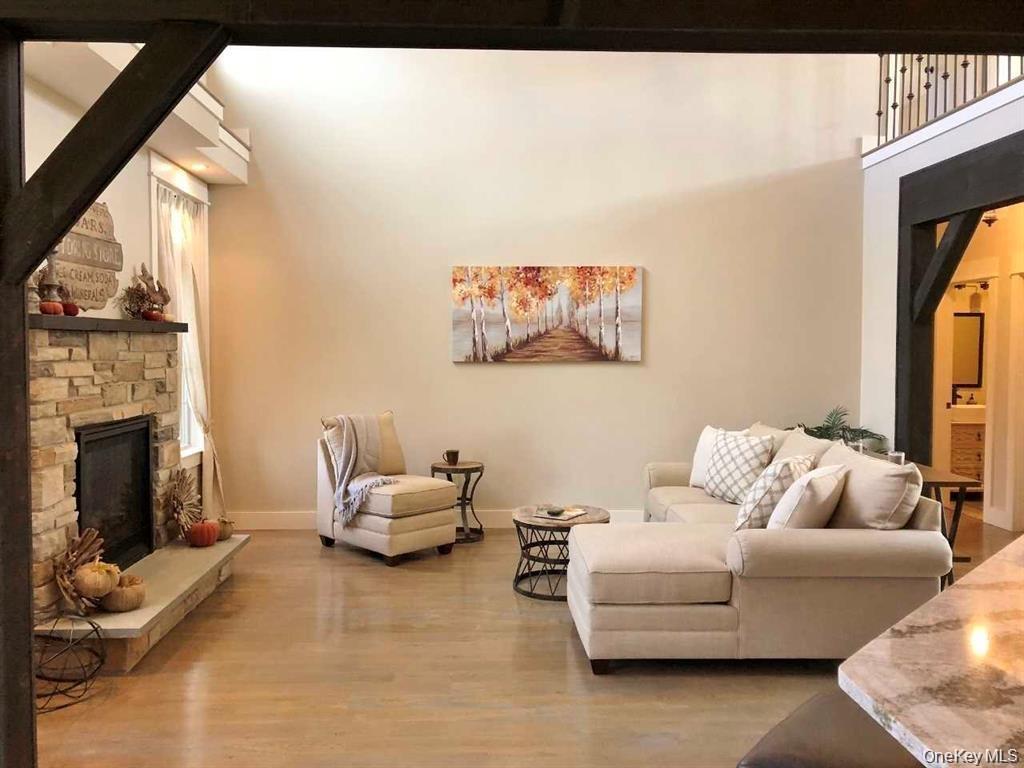 The spacious lower-level family room offers exceptional versatility with direct access to the backyard, garage, laundry area, fourth bedroom, and full