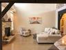 The spacious lower-level family room offers exceptional versatility with direct access to the backyard, garage, laundry area, fourth bedroom, and full