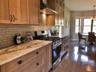 THoughtfully designed cabinetry and ample counter space create a functional and inviting workspace.