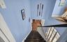 Staircase featuring baseboards and wood finished floors