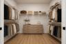 Dual sliding pocket doors leading to large walk-in closet