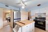 Kitchen with view into formal dining room.  There are two pantry closets