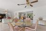 View of family room and informal eating area with view into formal areas.