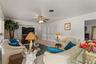 View of family room.  The double doors in the back right is a storage closet.  This home has LOTS OF STORAGE!