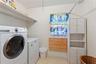 Laundry area accessible from the private suite.