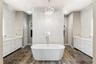 Polished Ceramic tile floor with dual linen closets