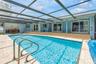 Rear view of pool & home