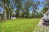 Expansive backyard with storage hut