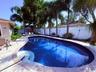 Freeform swimming pool with integrated steps