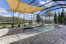 Pool, spill over spa, pavers, pond