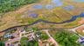 Aerial overview of property's location featuring a nearby body of water